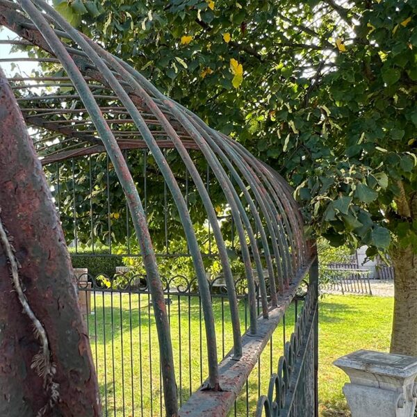 round bar grille with arched roof aviary