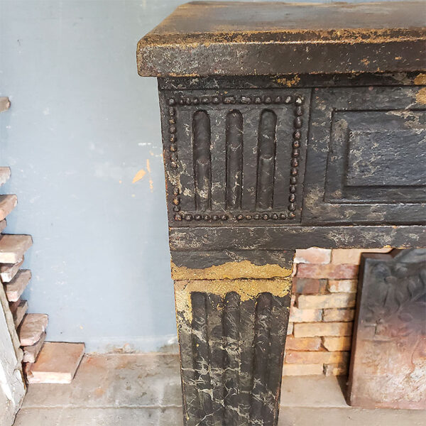 antique fireplace with fluted lintel