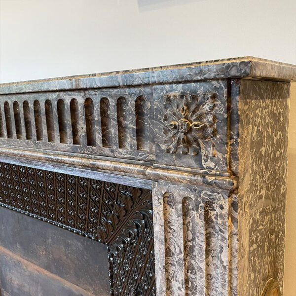 Louis XVI fireplace with carved flower