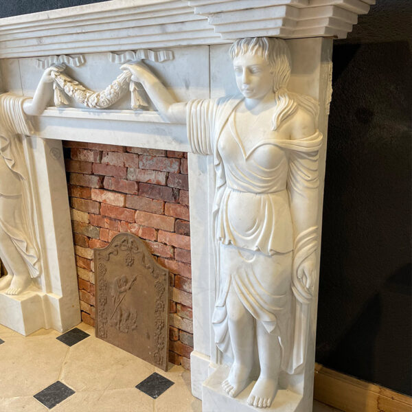marble fireplace with women sculpture