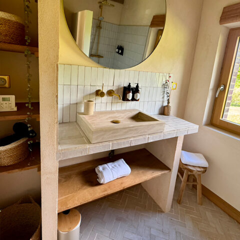 natural beige stone washbasin in bathroom