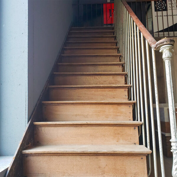 staircase with wrought iron railing