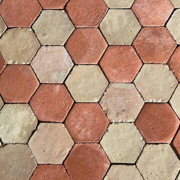 hexagonal red and beige mixed terracotta tiles
