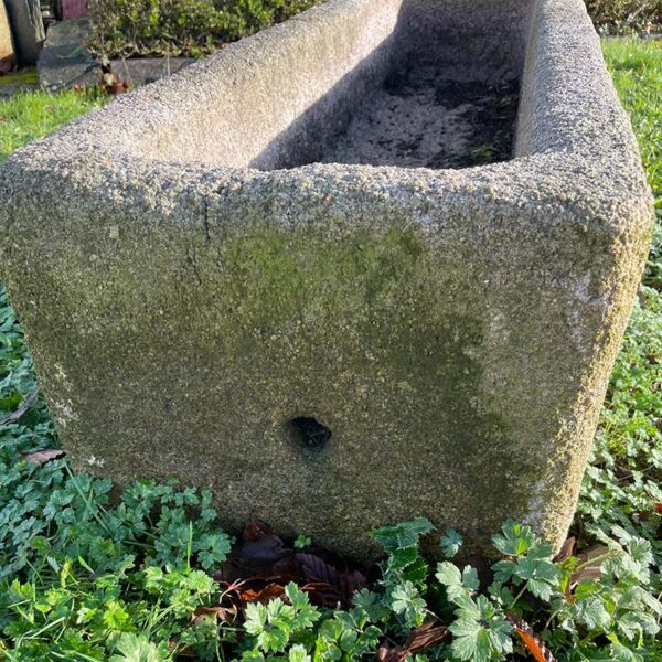 large granite trough hole at end