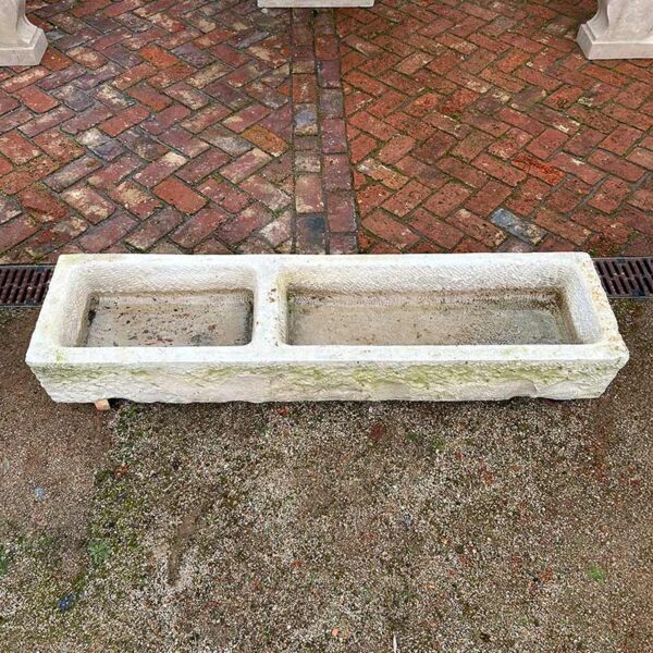 antique stone horse trough in stone