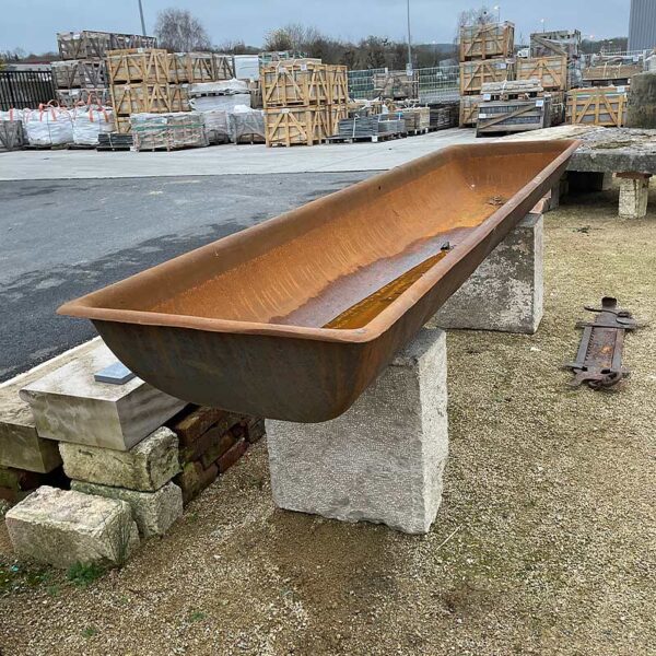 cast iron trough and stone base