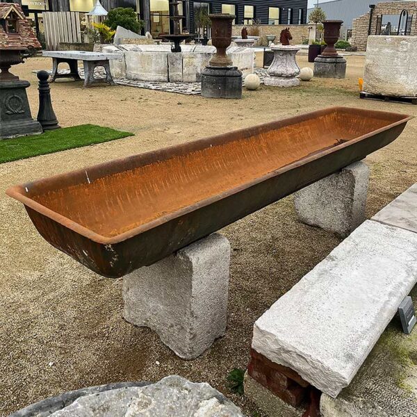 cast iron trough mounted on limestone