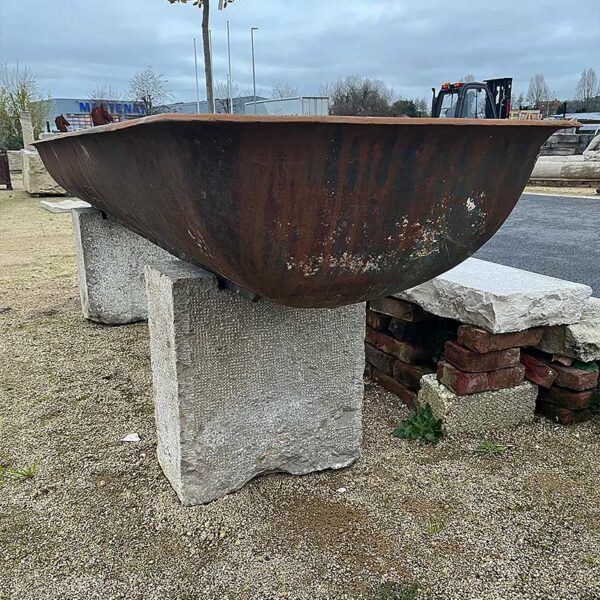 cast iron trough with cut stone base
