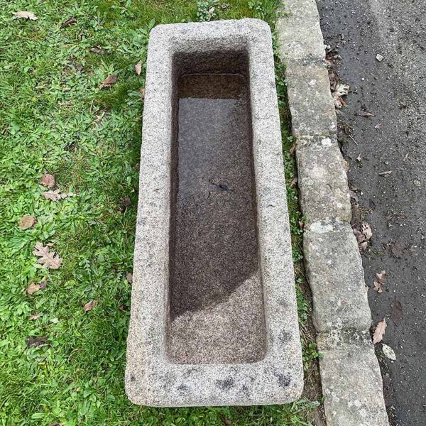 granite trough with rustic patinated edges