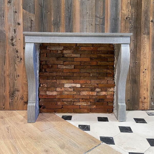 reclaimed grey stone fireplace