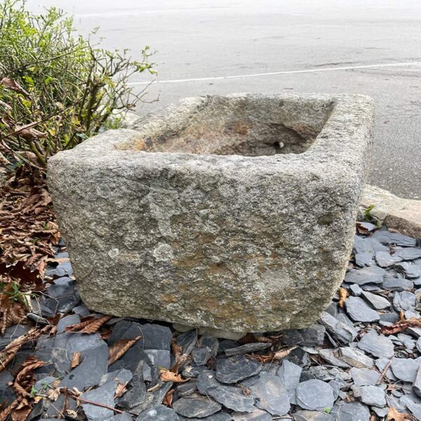 small granite trough with rustic edges