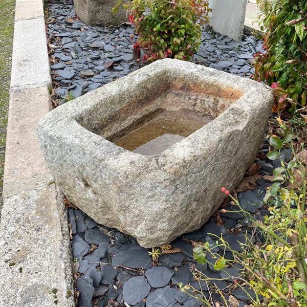 small reclaimed trough in natural granite stone