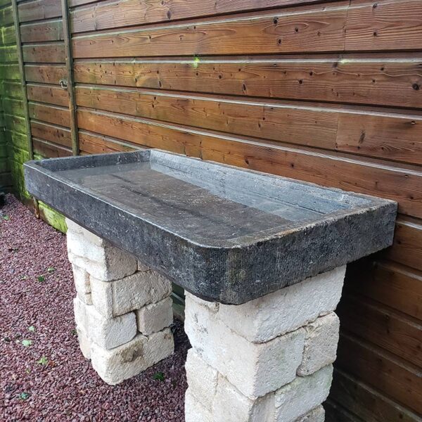 blue stone sink with chiseled edges