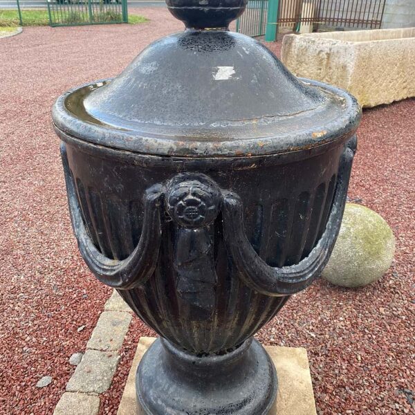 cast iron urn with garlands