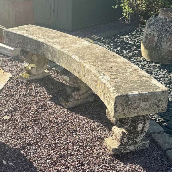 curved limestone stone bench