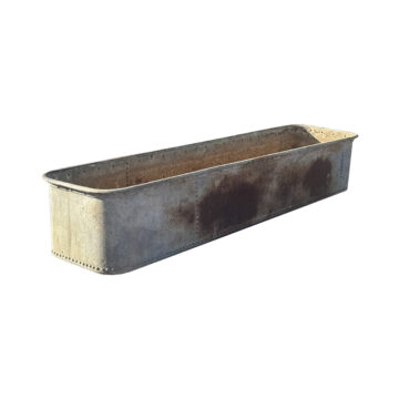 large iron trough with rivets