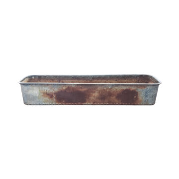 large iron trough with rivets