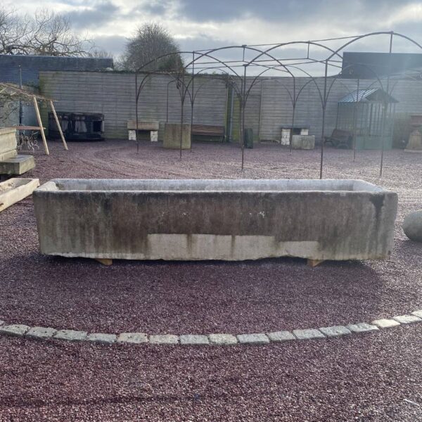 very long antique burgundy stone basin