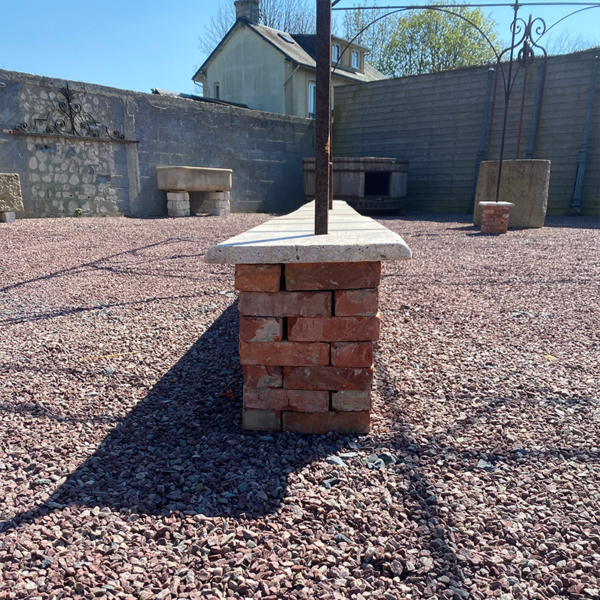 brick wall with travertine coping